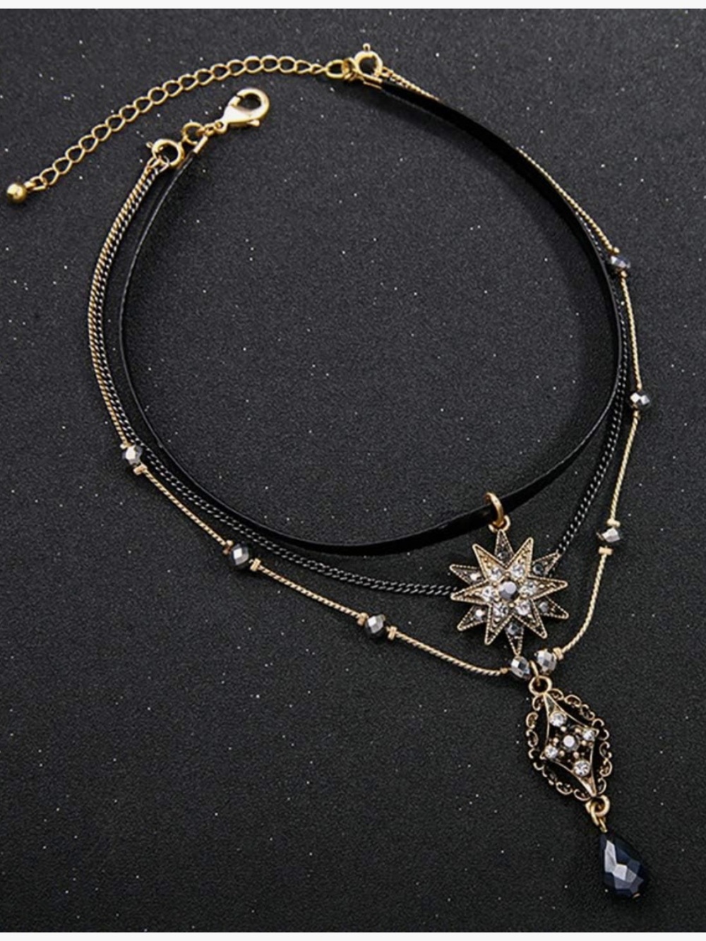 Anthropologie Black and Gold Tone Layered Starburst Pendant Necklace